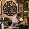 Personalized tattooer metal sign in 16 gauge steel with custom tattoo shop name for studio wall decor, tattoo artist workspace, shop and gift.